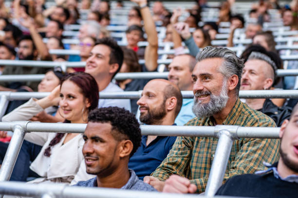istock Group of spectators cheering in stadium 1130450589