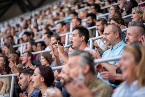 istock Group of spectators cheering in stadium 1130450590