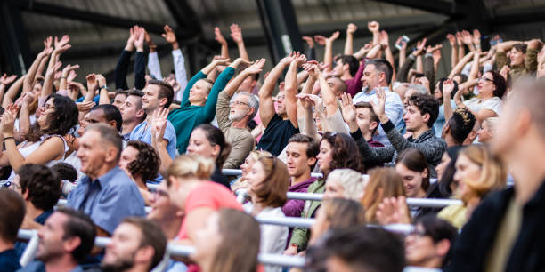 istock Group of spectators cheering in stadium 1130450591
