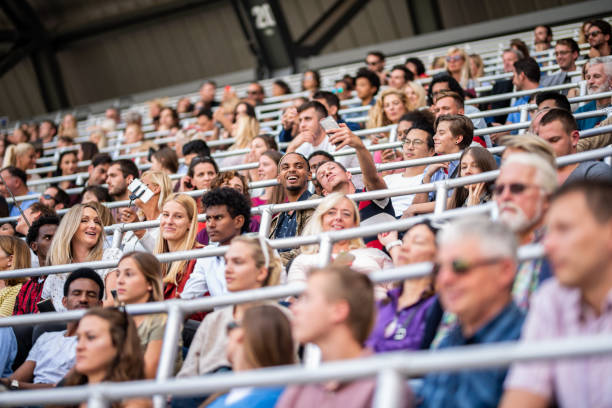 istock Group of spectators cheering in stadium 1130450596