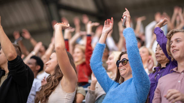 istock Group of spectators cheering in stadium 1130450597