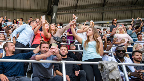 istock Group of spectators cheering in stadium 1130450599