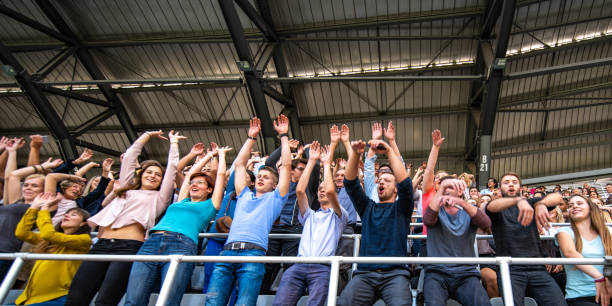 istock Group of spectators cheering in stadium 1130450604
