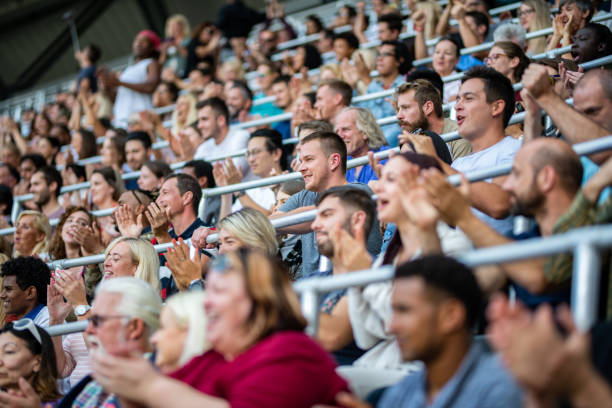 istock Group of spectators cheering in stadium 1130450609