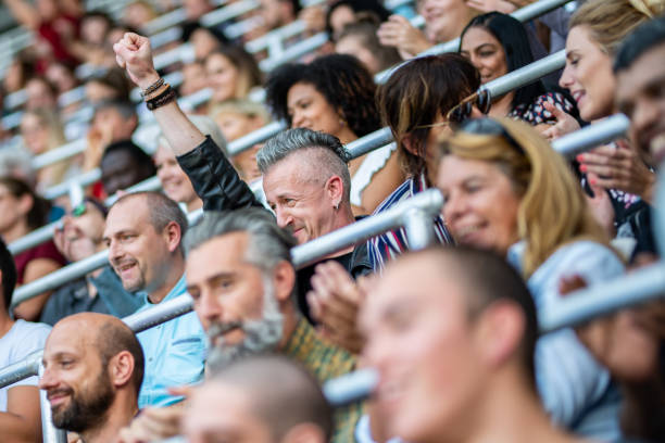 istock Group of spectators cheering in stadium 1130450610