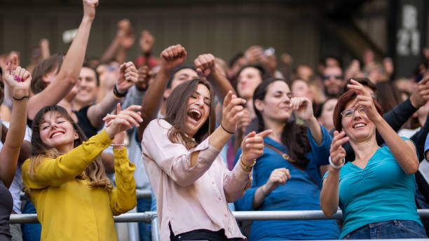 istock Group of spectators cheering in stadium 1130450611