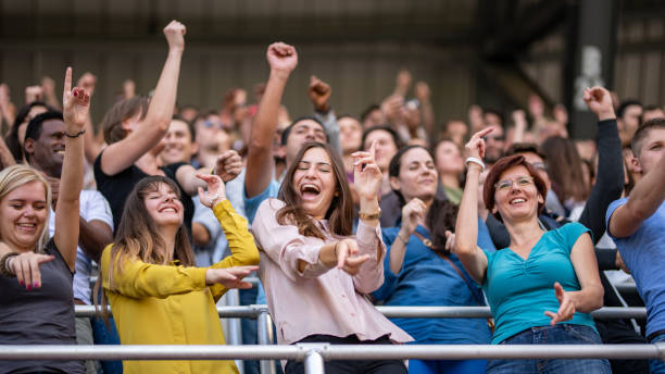 istock Group of spectators cheering in stadium 1130450619