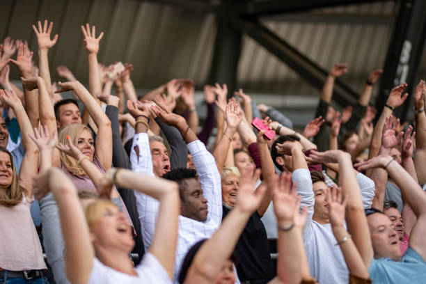 istock Group of spectators cheering in stadium 1130450623