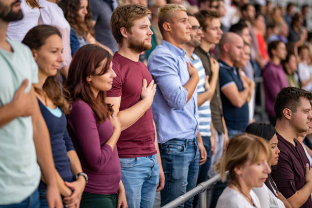 istock Spectators singing national anthem in stadium 1130450631
