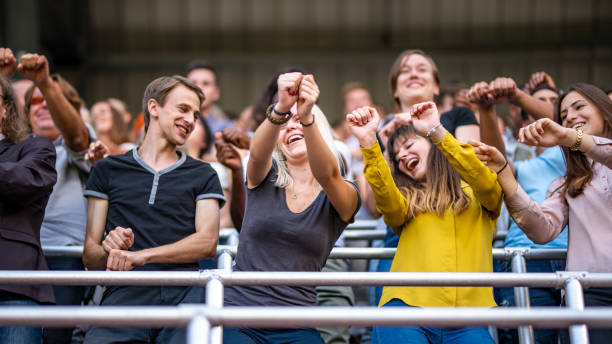 istock Group of spectators cheering in stadium 1130450634