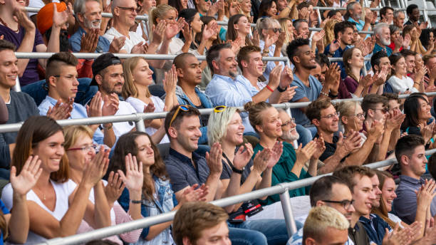istock Group of spectators cheering in stadium 1130450643