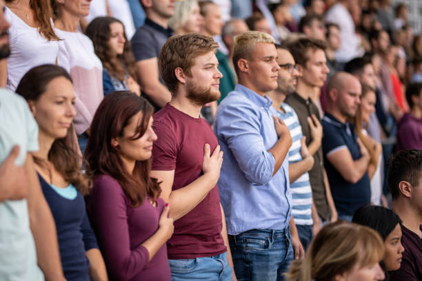 istock Spectators singing national anthem in stadium 1130450646