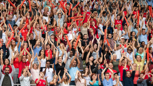 istock Group of spectators cheering in stadium 1130450673