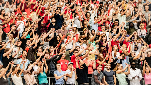 istock Group of spectators cheering in stadium 1130450676