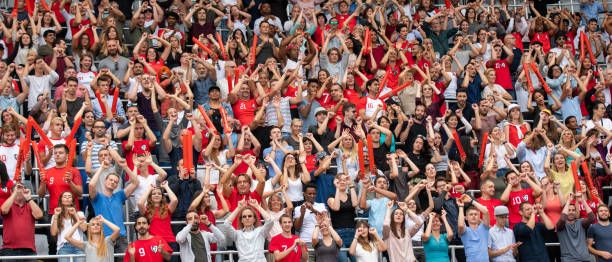 istock Group of spectators cheering in stadium 1130450677