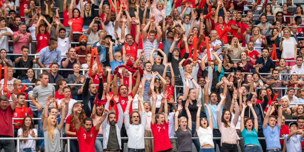 istock Group of spectators cheering in stadium 1130450679