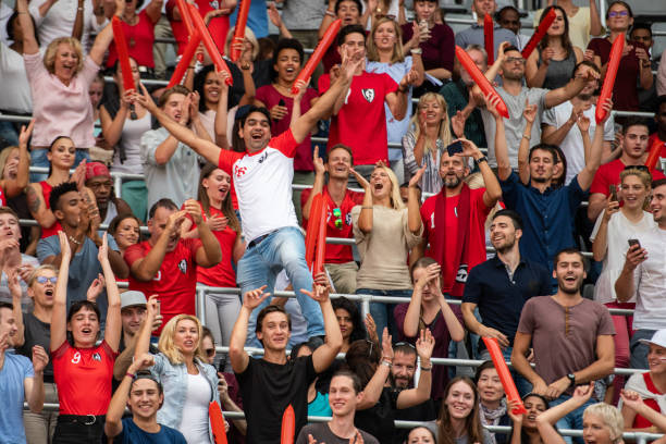 istock Group of spectators cheering in stadium 1130450681