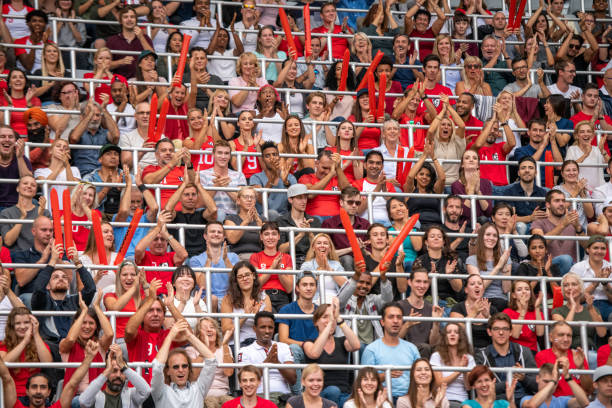 istock Group of spectators cheering in stadium 1130450683