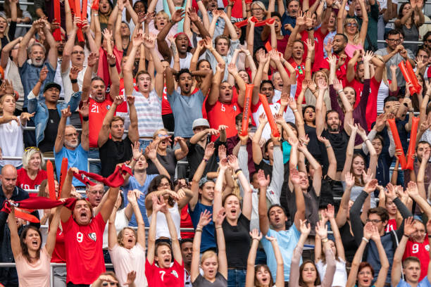 istock Group of spectators cheering in stadium 1130450684