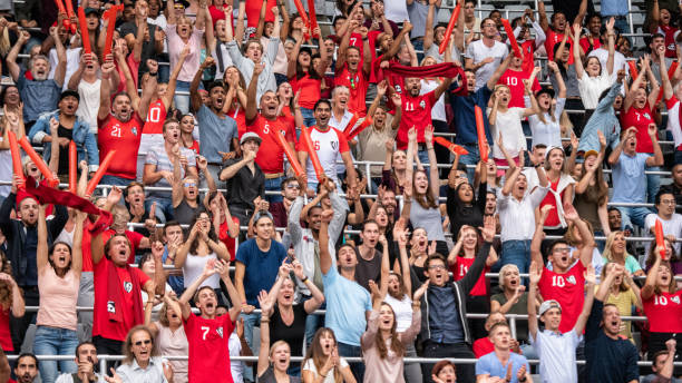 istock Group of spectators cheering in stadium 1130450687