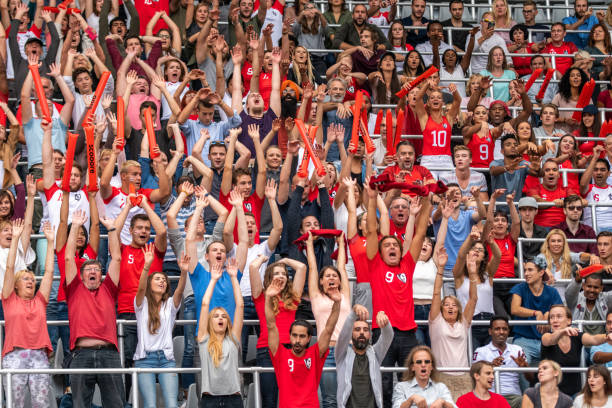 istock Group of spectators cheering in stadium 1130450688