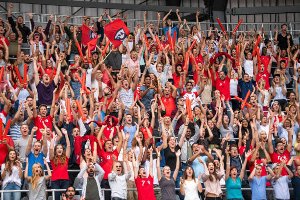 istock Group of spectators cheering in stadium 1130450697