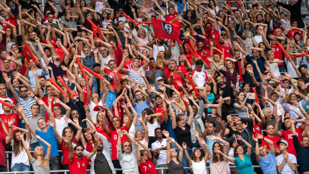 istock Group of spectators cheering in stadium 1130450698