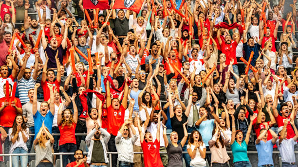 istock Group of spectators cheering in stadium 1130450709