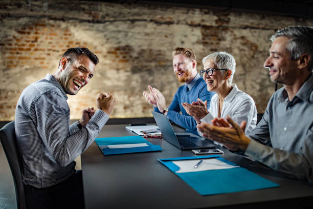 istock Happy HR team congratulating male candidate on successful job interview. 1130451709