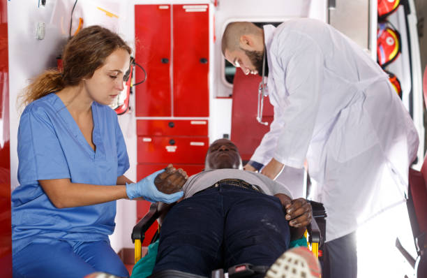 istock Paramedic team  providing first aid to man 1130451825