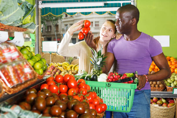 istock Couple is holding basket in time shopping 1130452182