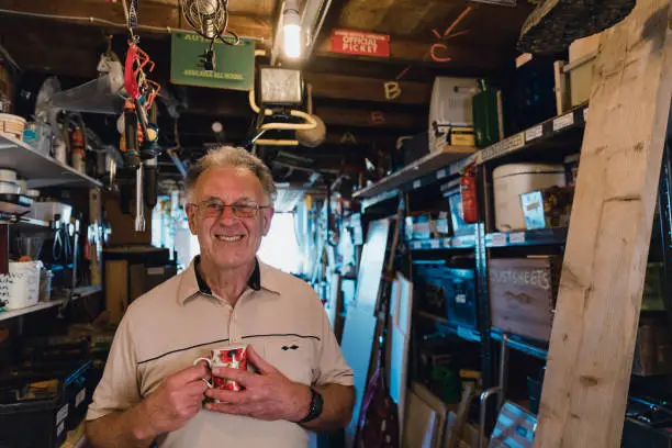 Photo of Portrait of a Senior Man in his Workshop