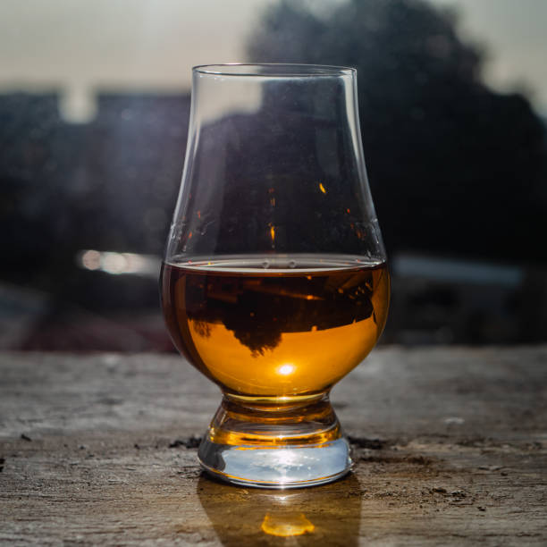 istock Irish whiskey Glass on Slate at Sunny Window 1130454815