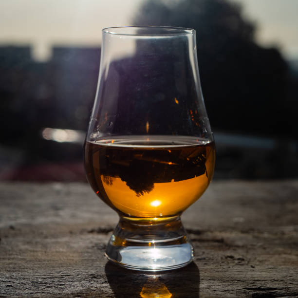 istock Irish whiskey Glass on Slate at Sunny Window 1130454839