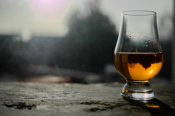 Irish whiskey Glass on Slate at Sunny Window