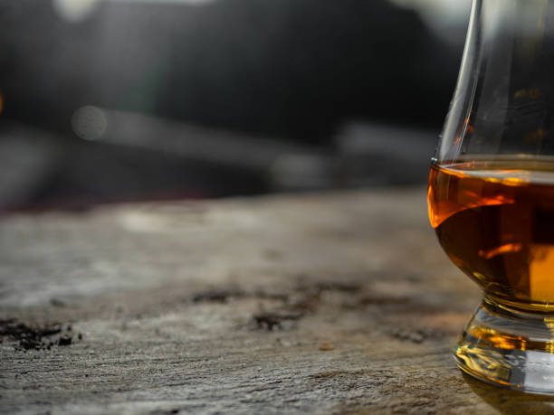istock Irish whiskey Glass on Slate at Sunny Window 1130454860