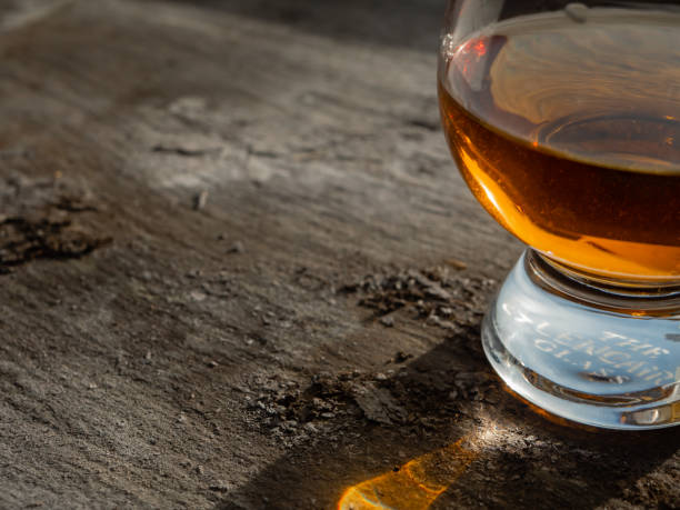 istock Irish whiskey Glass on Grey Slate in Sunshine 1130454872