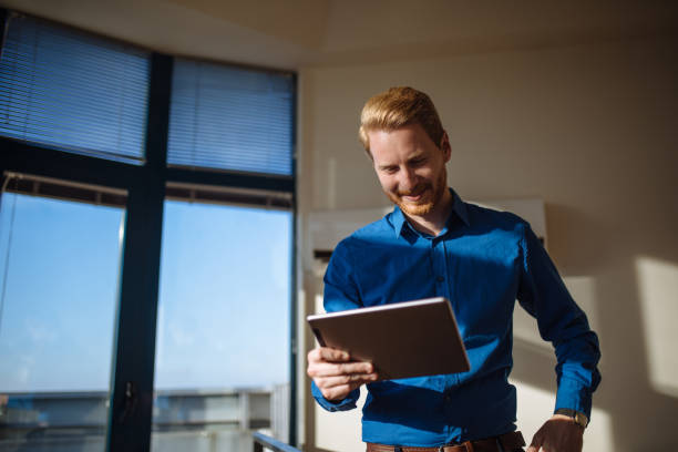 istock Successful businessman using digital tablet and surfing the net 1130456011
