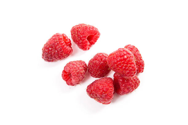 istock Ripe raspberries isolated on white background 1130457653