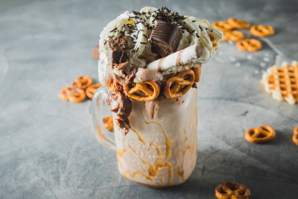 istock Sweet milkshake drink with dripping sauce, cream and chocolate 1130457761