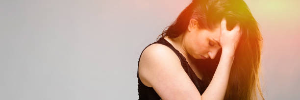 istock Emotional pretty confident bewildered upset plus size model standing in studio on gray background 1130458096