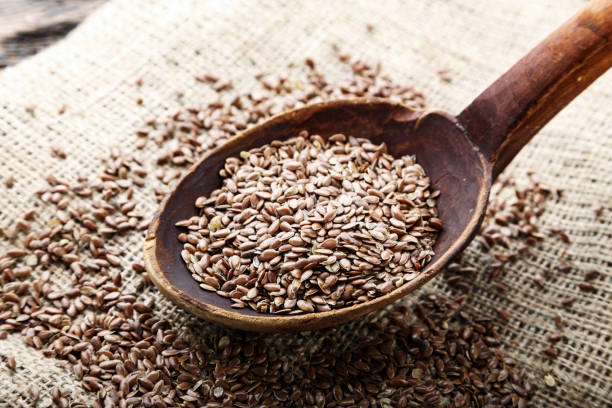 istock wooden spoon with flax seed placed 1130460060