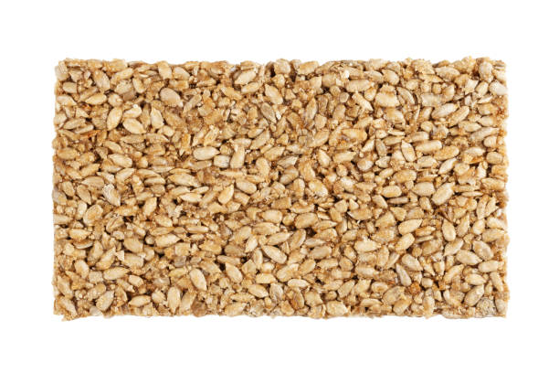istock sunflower seed kozinaki isolated on white background. 1130460243