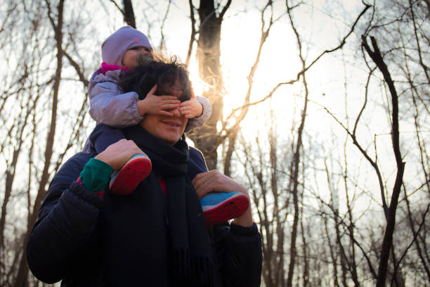 istock Young dad carrying baby on his shoulders 1130461097