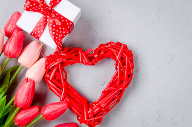 istock wicker heart, gift box and tulips 1130461565