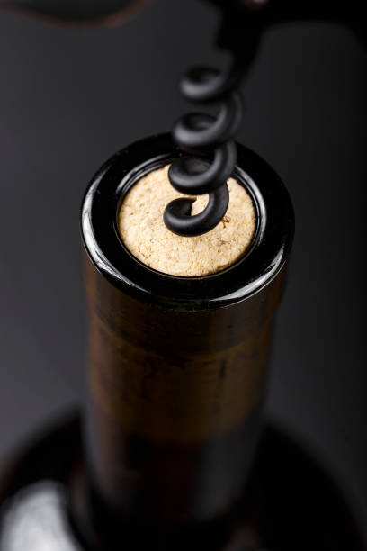 istock corkscrew in a wine cork in a bottle of wine. 1130461566