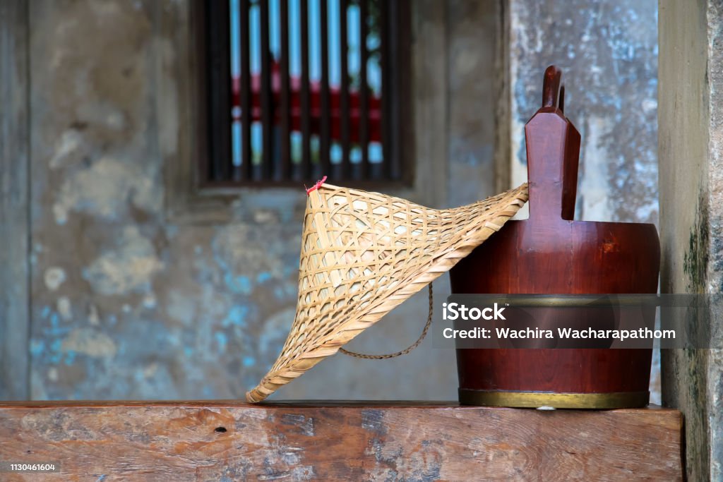 Chinese bamboo hat and wooden bucket Abstract Stock Photo