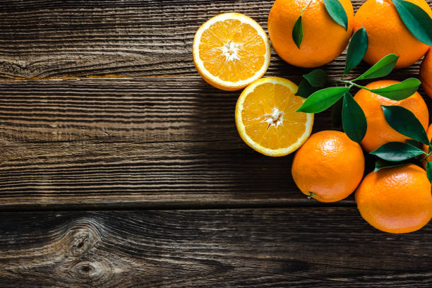 istock Fresh orange, flat lay on wooden background 1130462723