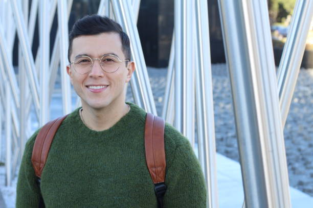 Cute ethnic man smiling outdoors.