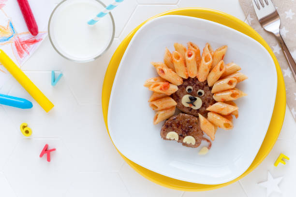 istock Cute lion shaped meat burger with pasta for kids 1130463635